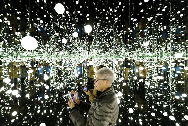 A room filled with white orbs and mirrors.